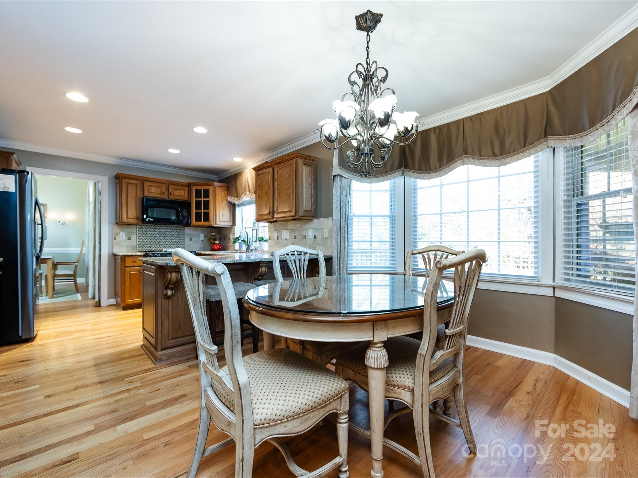3534 Nestling Lane Fort Mill, SC 29708 - Photo 15 of 44 a view of a dining room with furniture window and wooden floor