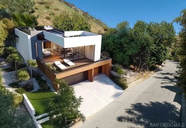 a view of a backyard with sitting area