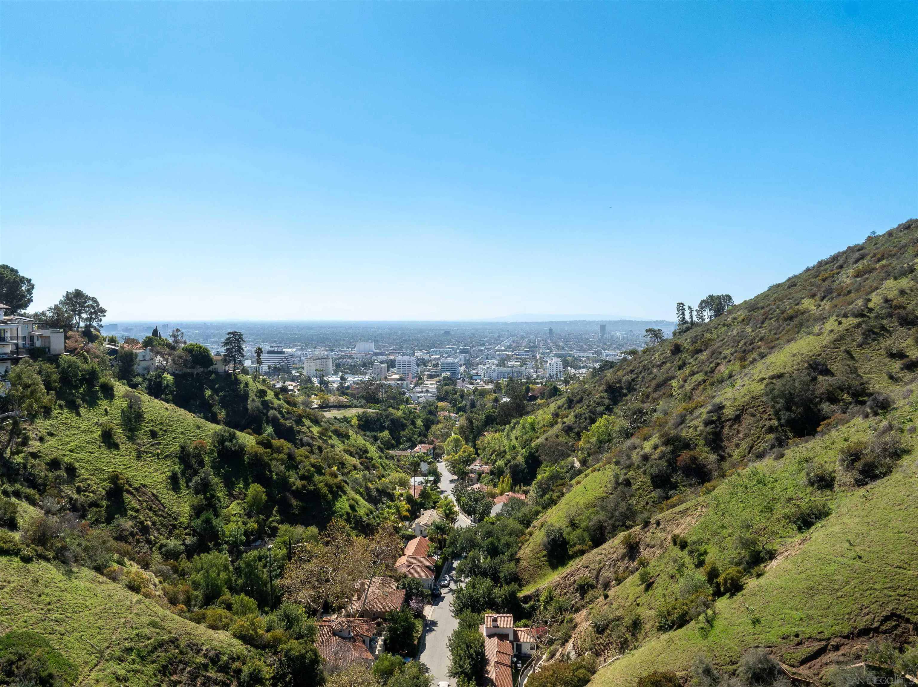 2133 Outpost Drive, Unit 1 Los Angeles, CA 90068 - Photo 2 of 13 an aerial view of a houses with a yard and mountain