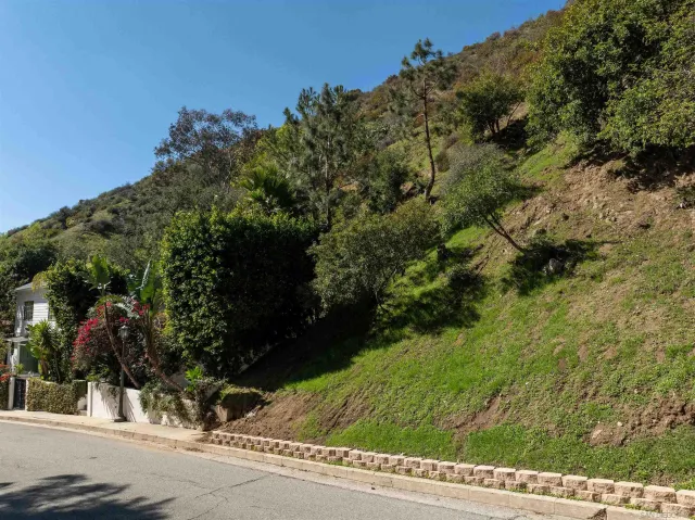 a view of a street with a building in the background