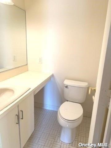 141 Great Neck Road, Unit 3A Great Neck, NY 11021 - Photo 7 of 15 a white toilet sitting next to a sink