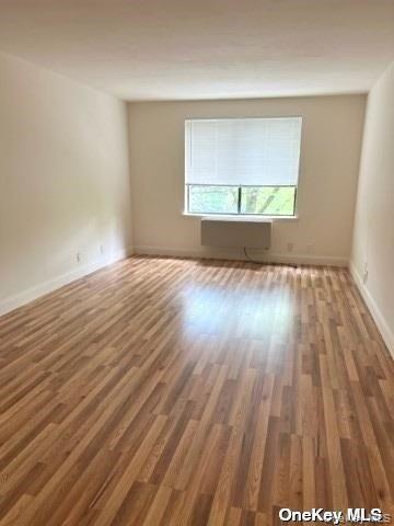 141 Great Neck Road, Unit 3A Great Neck, NY 11021 - Photo 8 of 15 a view of an empty room and wooden floor