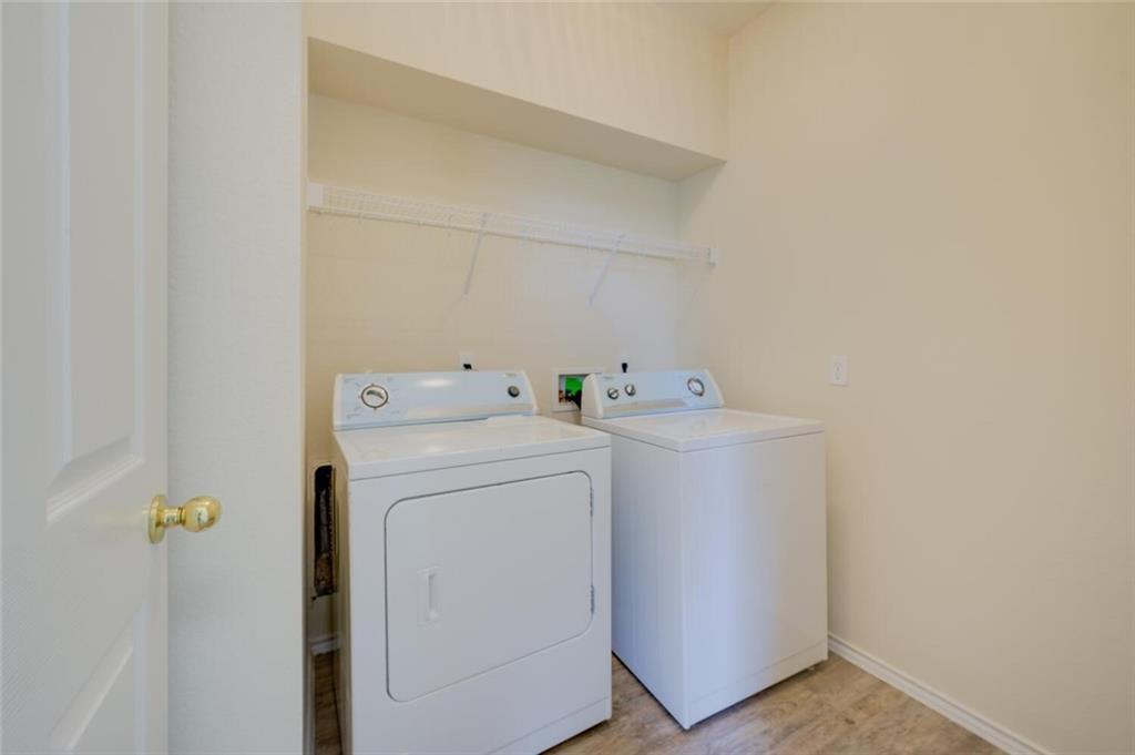 801 Jane Austen Trail, Unit B Pflugerville, TX 78660 - Photo 17 of 21 a utility room with dryer and washer