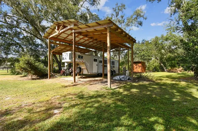 a view of swimming pool with outdoor seating and yard