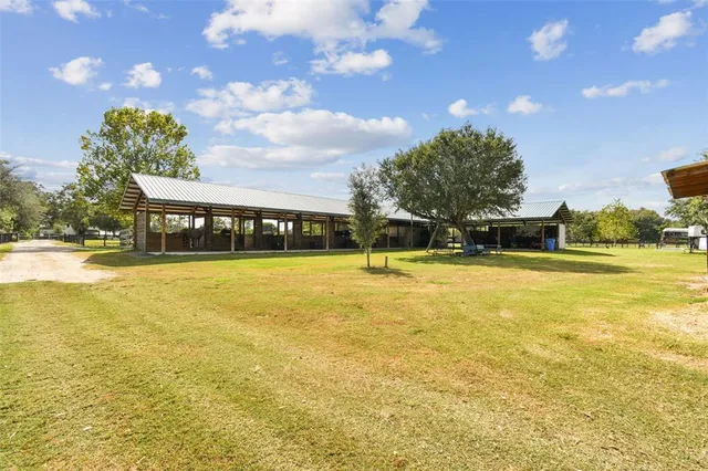a view of a swimming pool with an outdoor seating and a garden