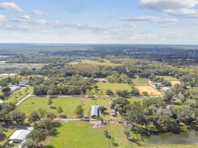 an aerial view of residential building and ocean