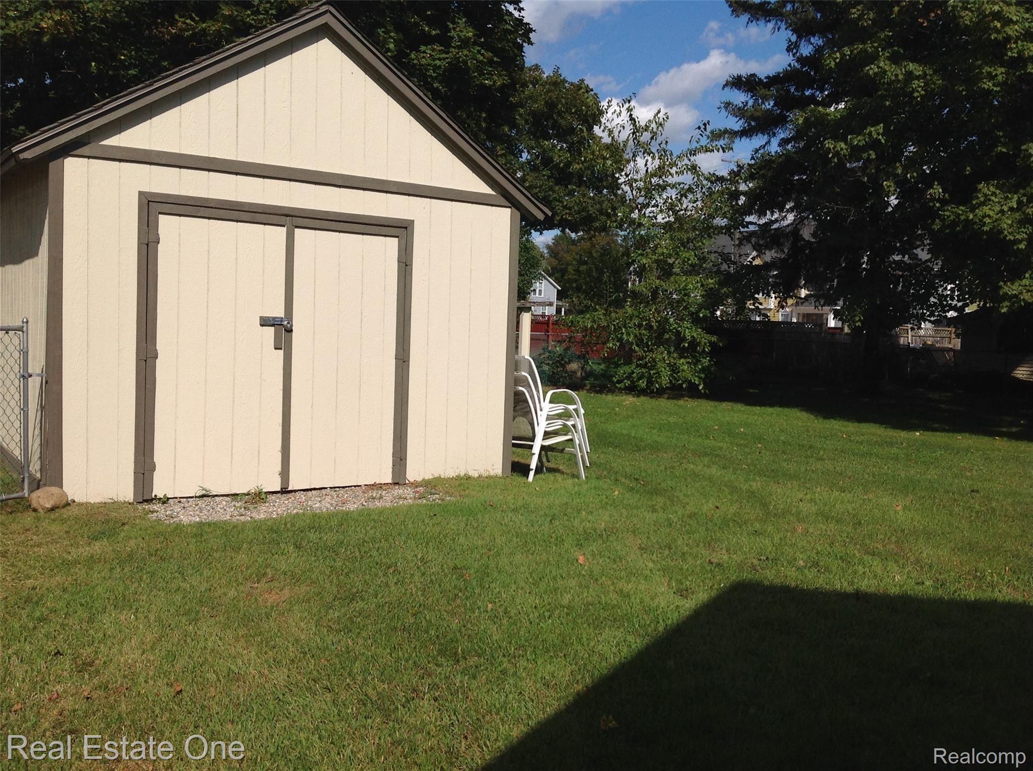 150 West Livingston Road Highland, MI 48357 - Photo 33 of 36 Shed, fenced in yard