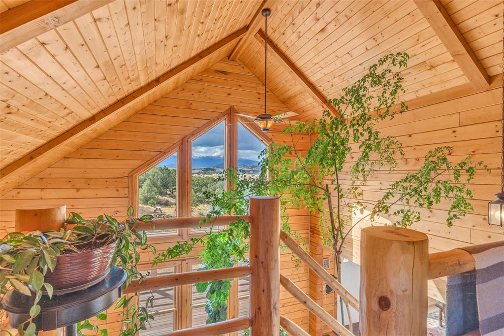 1350 Mitchell Mountain Road Westcliffe, CO 81252 - Photo 17 of 45 a view of a house with a cars park