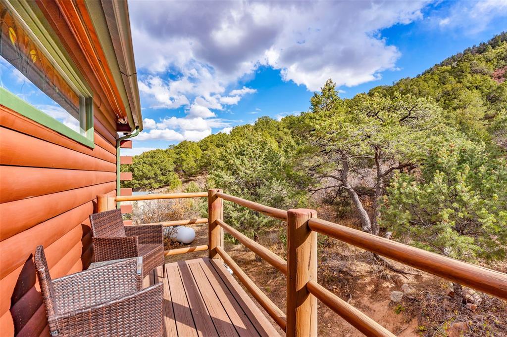 1350 Mitchell Mountain Road Westcliffe, CO 81252 - Photo 20 of 45 a view of balcony with wooden floor and fence