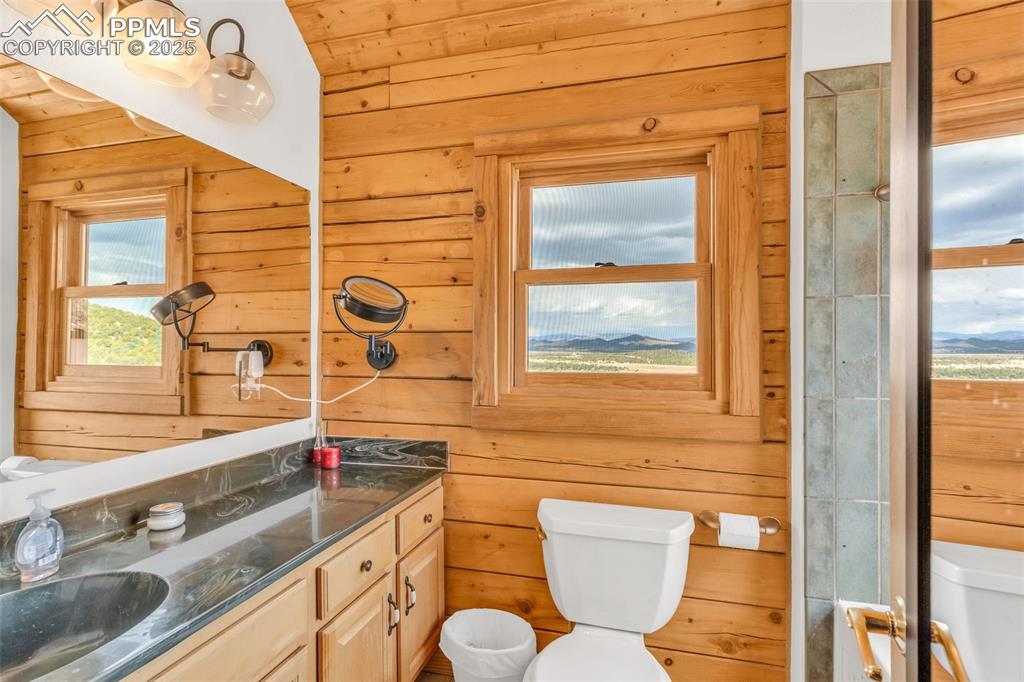 1350 Mitchell Mountain Road Westcliffe, CO 81252 - Photo 21 of 45 a bathroom with a sink and a large mirror