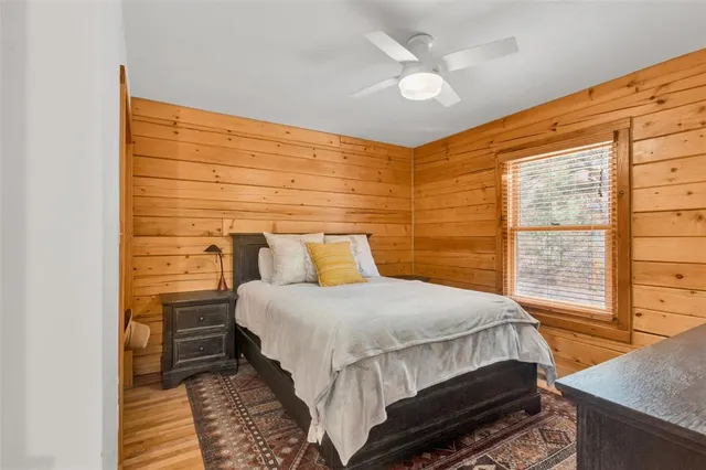 a bedroom with a bed and window