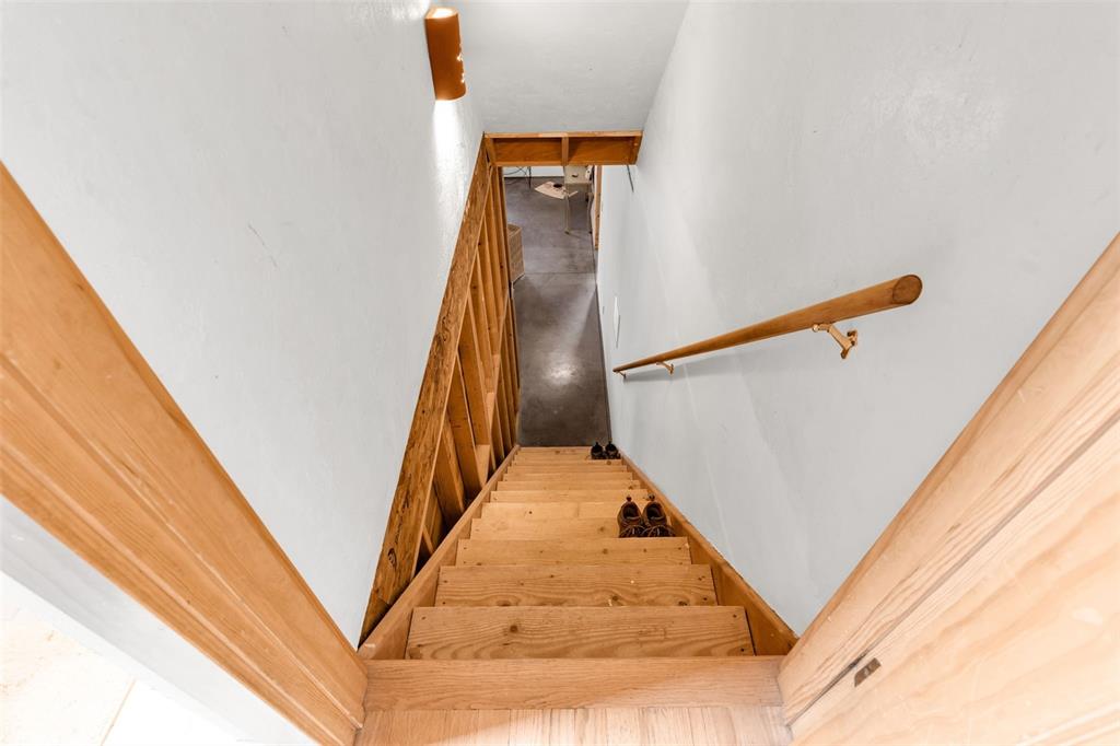 1350 Mitchell Mountain Road Westcliffe, CO 81252 - Photo 26 of 45 a view of staircase with railing and white walls