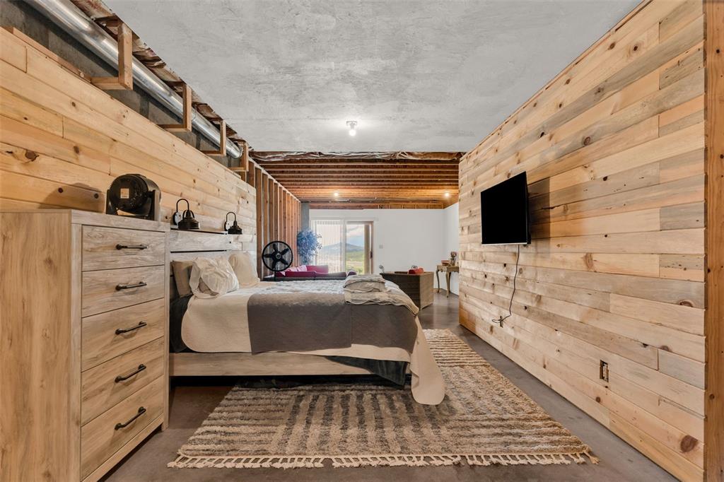 1350 Mitchell Mountain Road Westcliffe, CO 81252 - Photo 31 of 45 a room with furniture and a flat screen tv