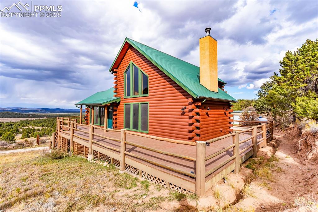 1350 Mitchell Mountain Road Westcliffe, CO 81252 - Photo 40 of 45 a front view of a house with a yard