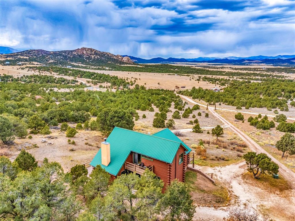 1350 Mitchell Mountain Road Westcliffe, CO 81252 - Photo 41 of 45 a view of a city with an ocean beach