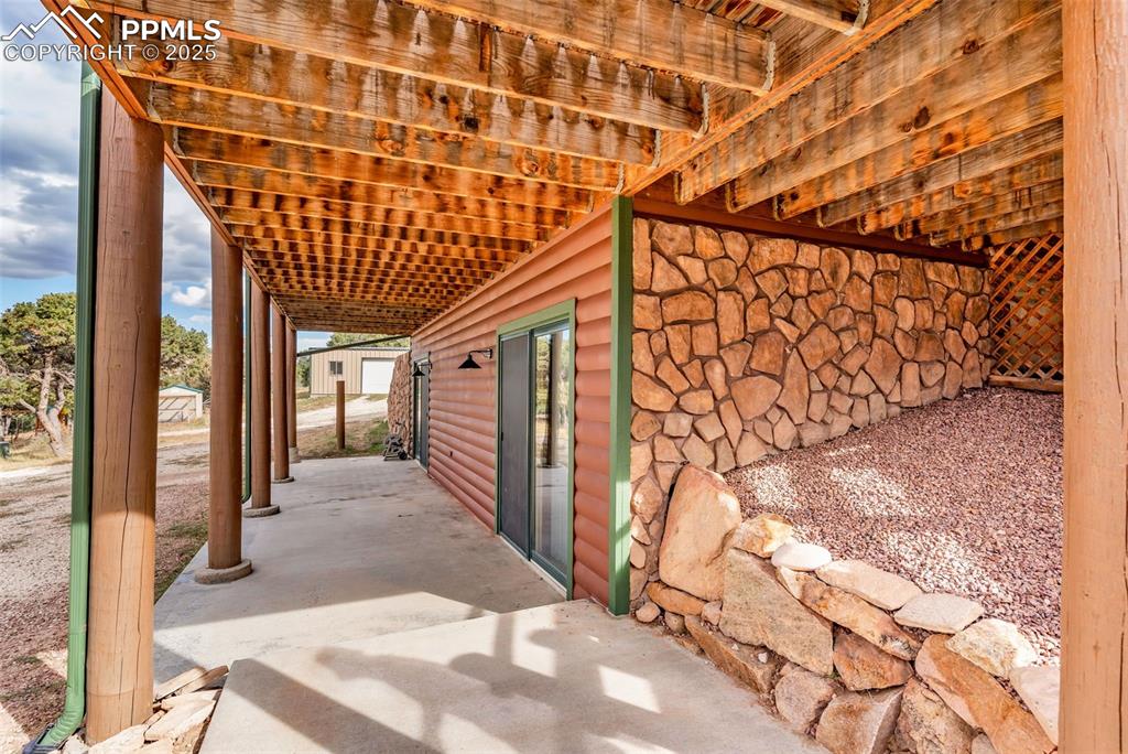 1350 Mitchell Mountain Road Westcliffe, CO 81252 - Photo 42 of 45 a view of a porch with a backyard