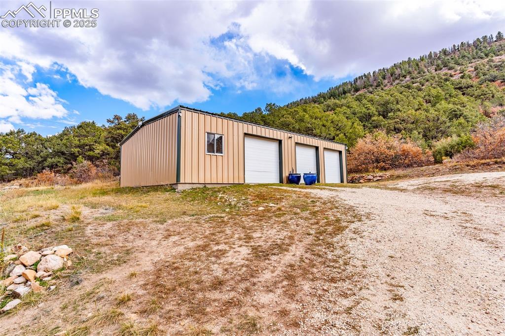 1350 Mitchell Mountain Road Westcliffe, CO 81252 - Photo 43 of 45 a view of a house with a snow