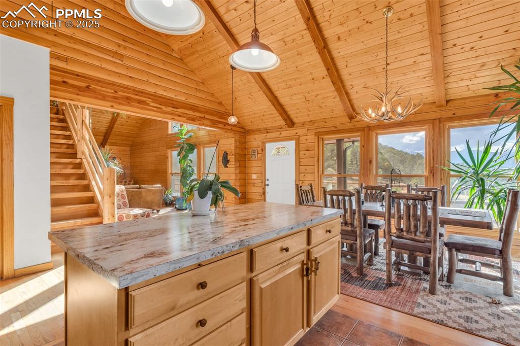 1350 Mitchell Mountain Road Westcliffe, CO 81252 - Photo 10 of 45 a kitchen with a table chairs and entryway