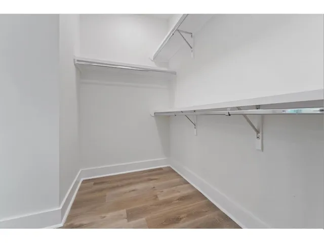 a view of an empty walk in closet