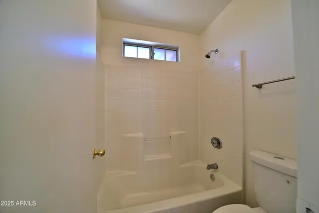 a view of a hallway with closet and front door