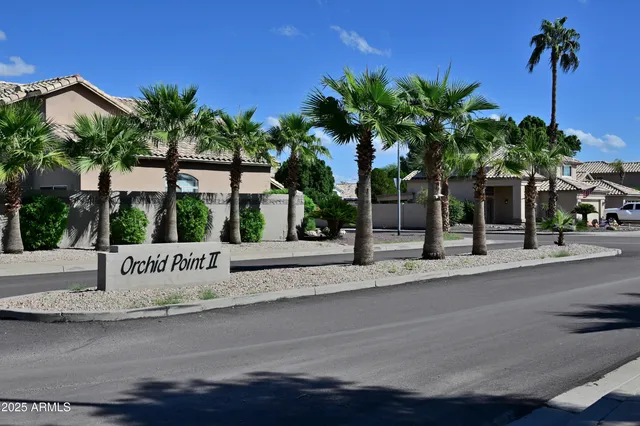 a view of a house with a cars park