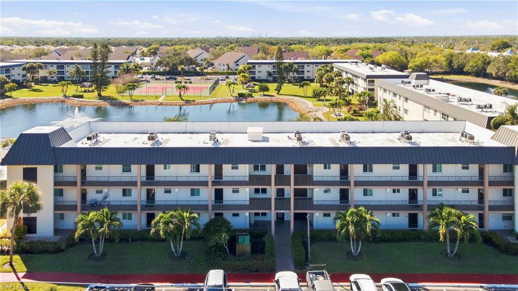 1010 Manatee Road, Unit B304 Naples, FL 34114 - Photo 19 of 24 a view of swimming pool with outdoor seating and city view
