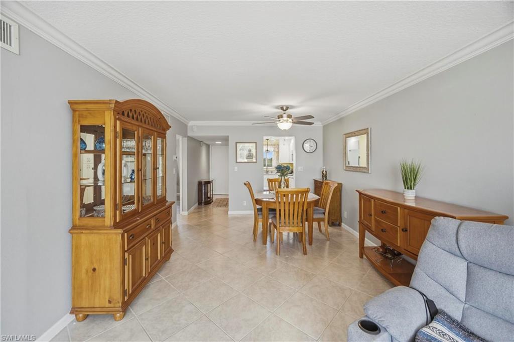 1010 Manatee Road, Unit B304 Naples, FL 34114 - Photo 22 of 24 a dining room with furniture and window