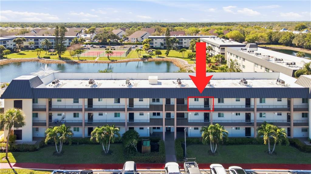 1010 Manatee Road, Unit B304 Naples, FL 34114 - Photo 6 of 24 a view of swimming pool with outdoor seating
