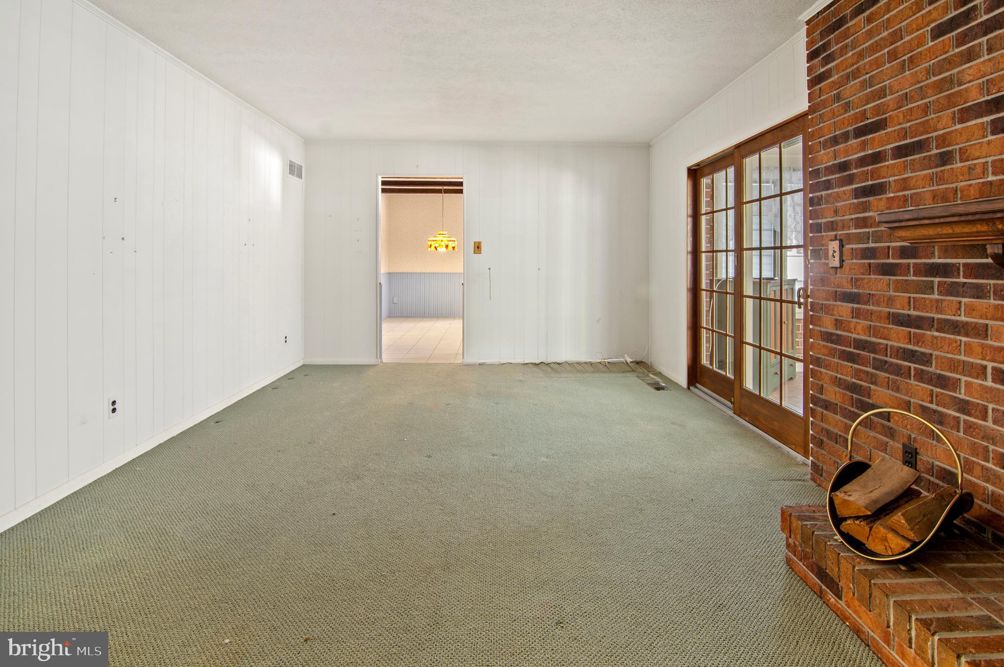 3005 Moores Road Baldwin, MD 21013 - Photo 19 of 56 Spacious room with charming brick fireplace.