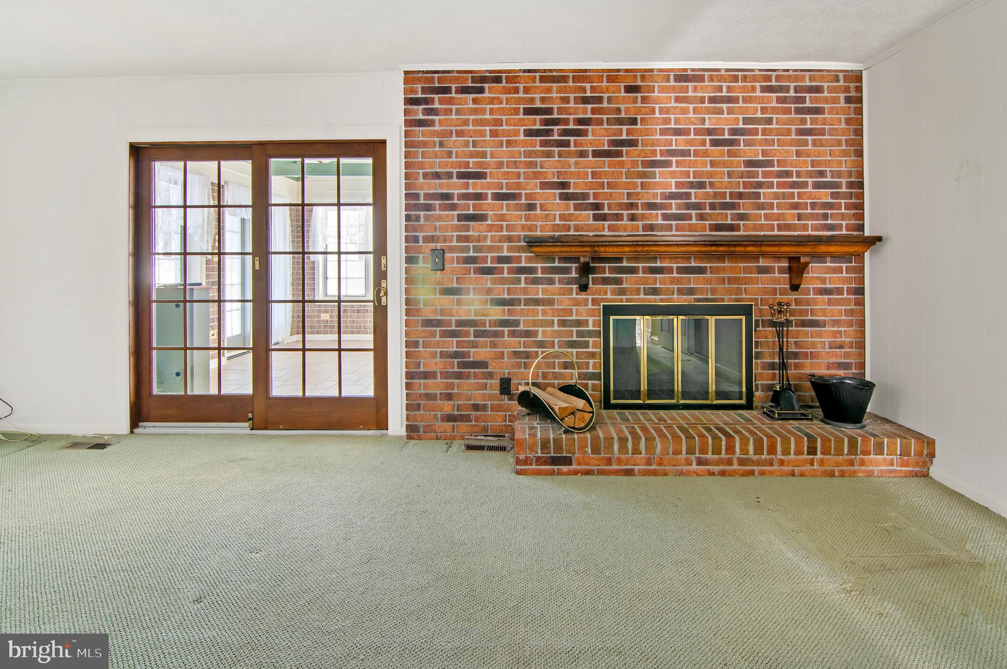 3005 Moores Road Baldwin, MD 21013 - Photo 20 of 56 Cozy space with a classic brick fireplace.