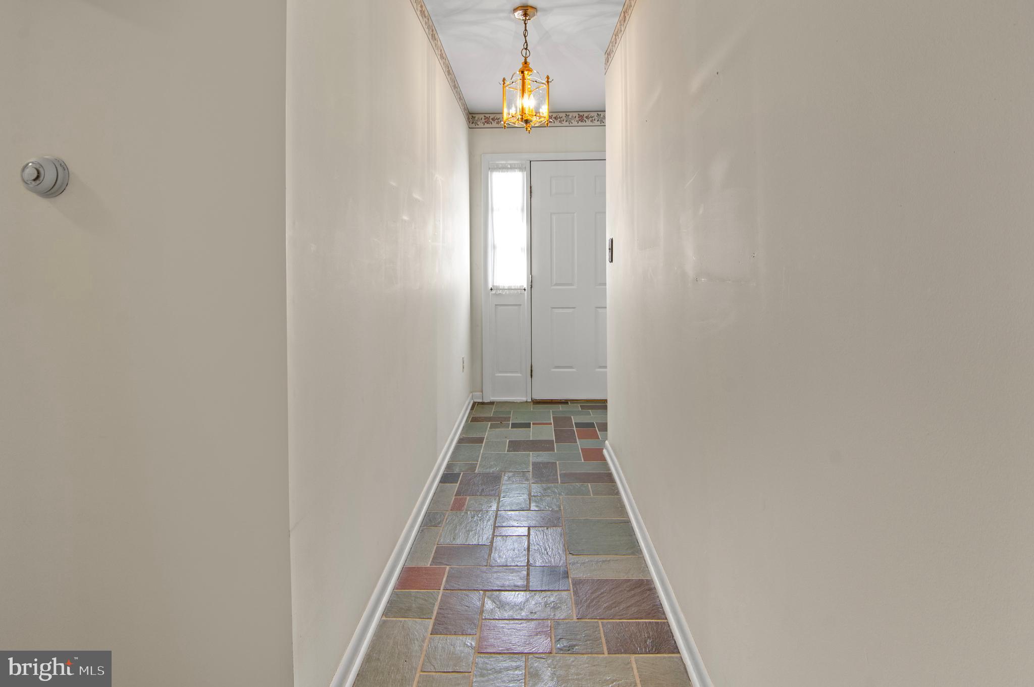 3005 Moores Road Baldwin, MD 21013 - Photo 21 of 56 Inviting hallway with charming slate flooring.