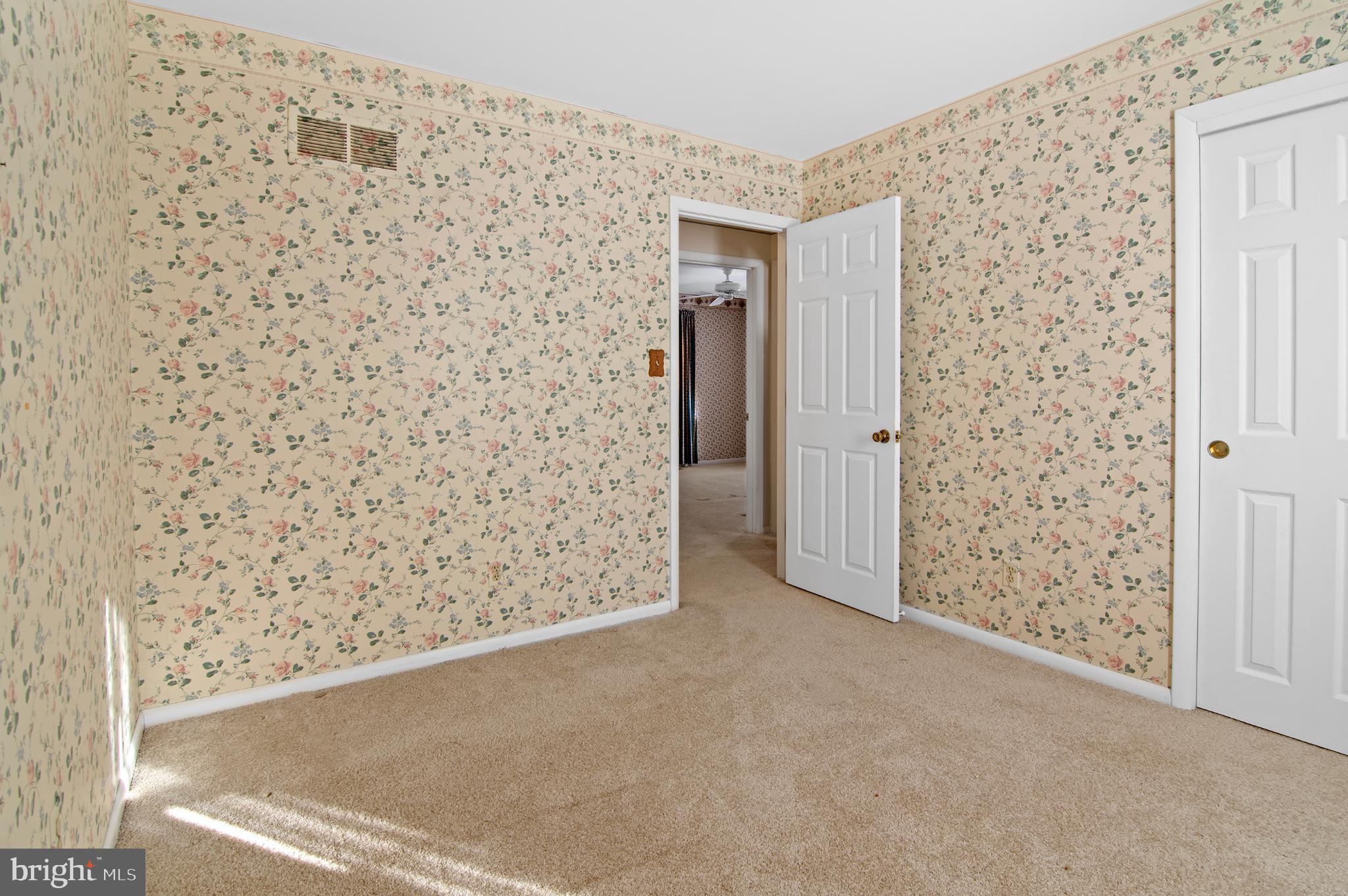 3005 Moores Road Baldwin, MD 21013 - Photo 28 of 56 Charming room with floral wallpaper accents.