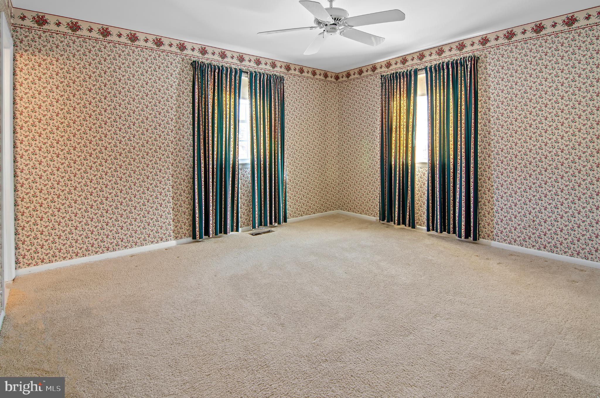 3005 Moores Road Baldwin, MD 21013 - Photo 29 of 56 Bright, spacious room with floral wallpaper.