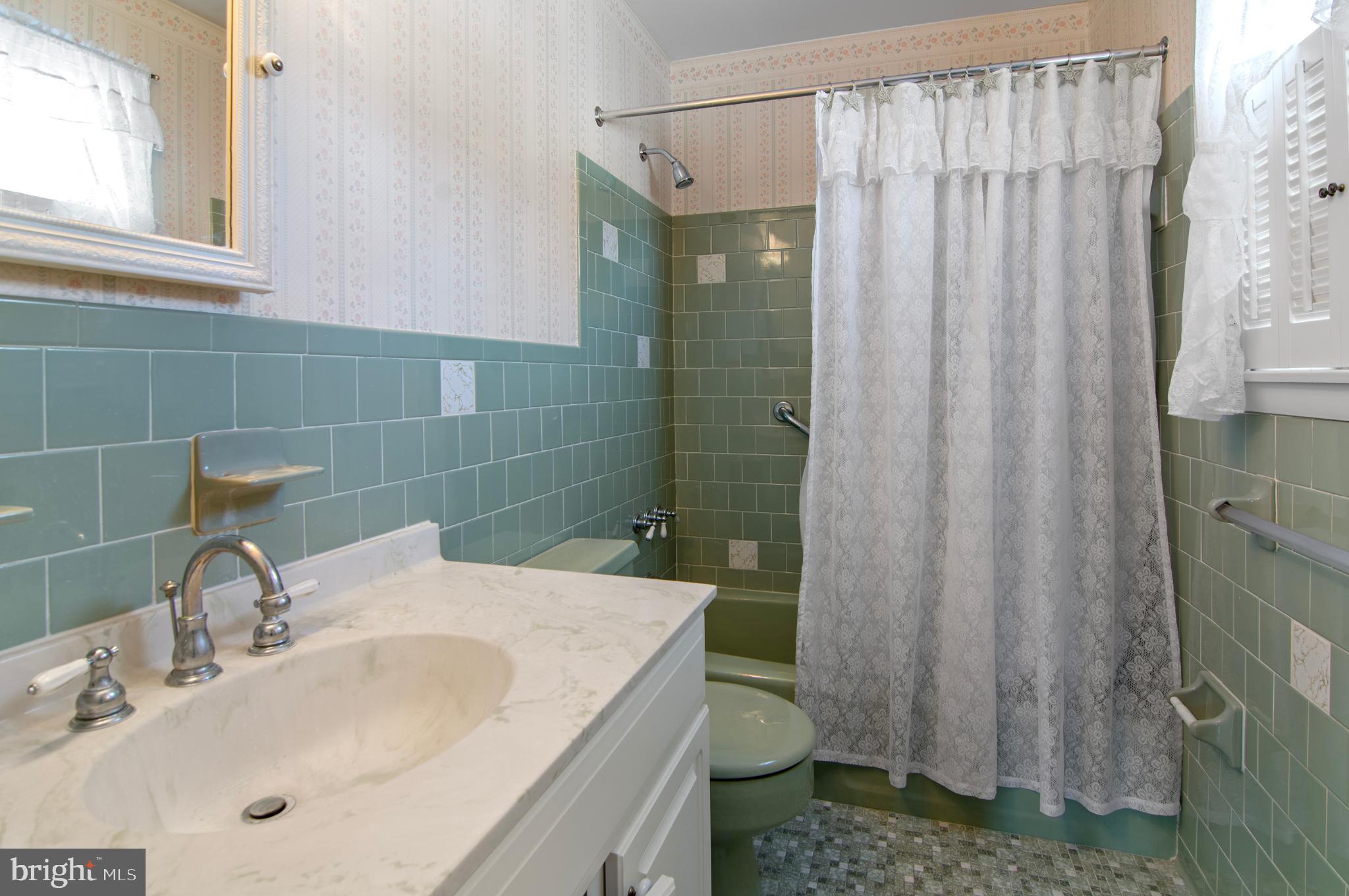 3005 Moores Road Baldwin, MD 21013 - Photo 34 of 56 Charming vintage bathroom with pastel tiles.