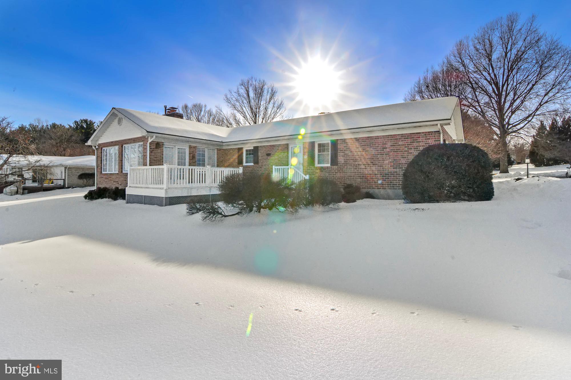 3005 Moores Road Baldwin, MD 21013 - Photo 48 of 56 Sunlit home nestled in a snowy landscape.