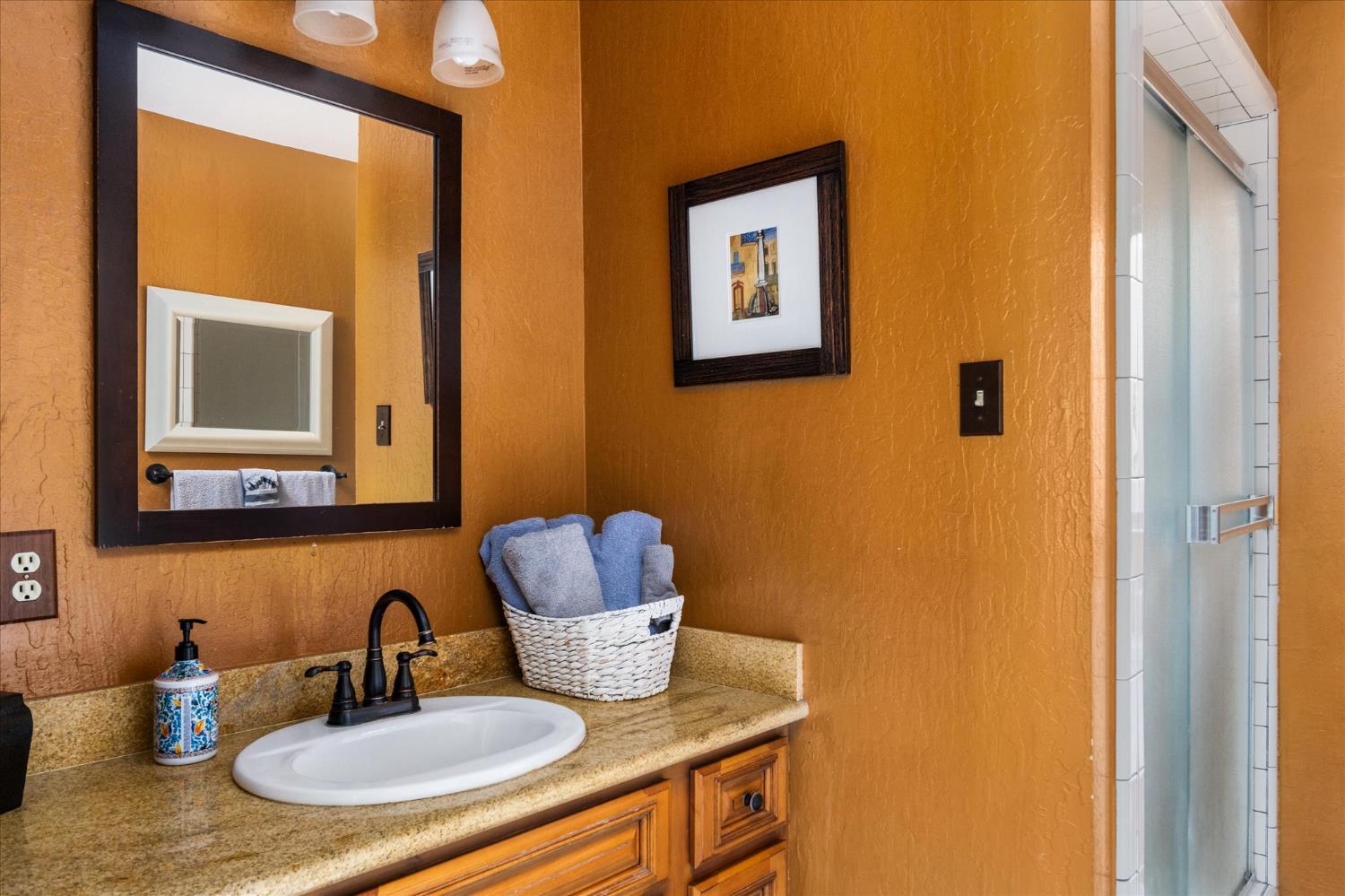 485 Moran Road Arnold, CA 95223 - Photo 18 of 49 a bathroom with a sink and a mirror