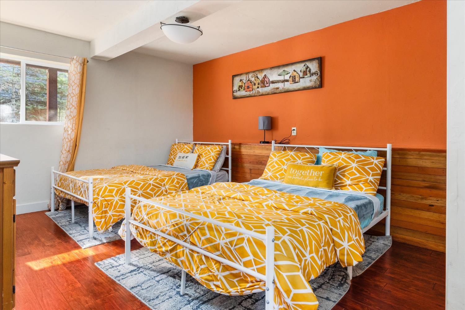 485 Moran Road Arnold, CA 95223 - Photo 25 of 49 a bed sitting in a bedroom next to a window with wooden floor