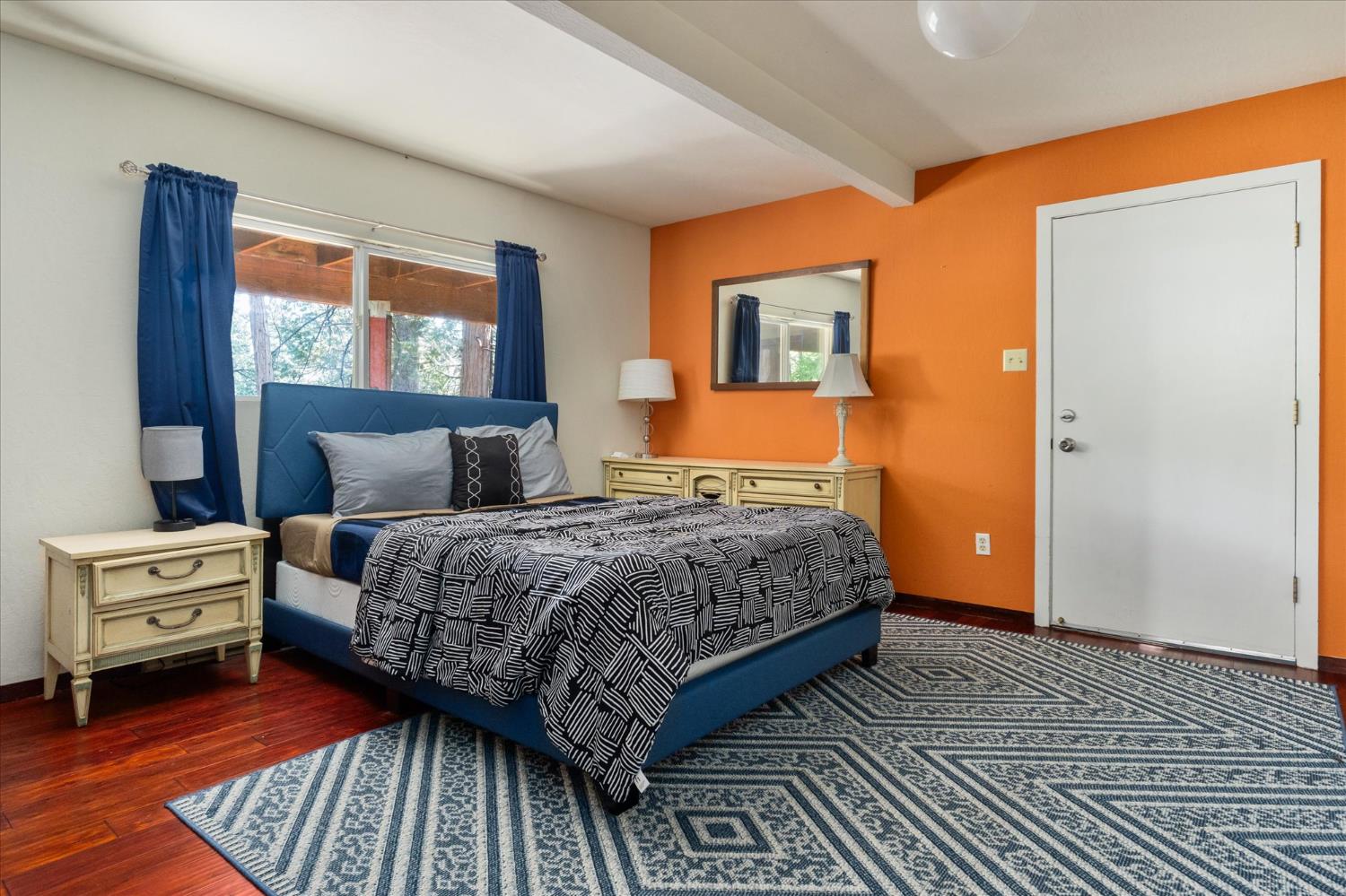 485 Moran Road Arnold, CA 95223 - Photo 27 of 49 a bedroom with a bed and wooden floor