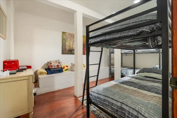a bedroom with a bed and a dresser