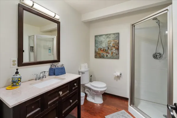 a bathroom with a sink vanity and a mirror