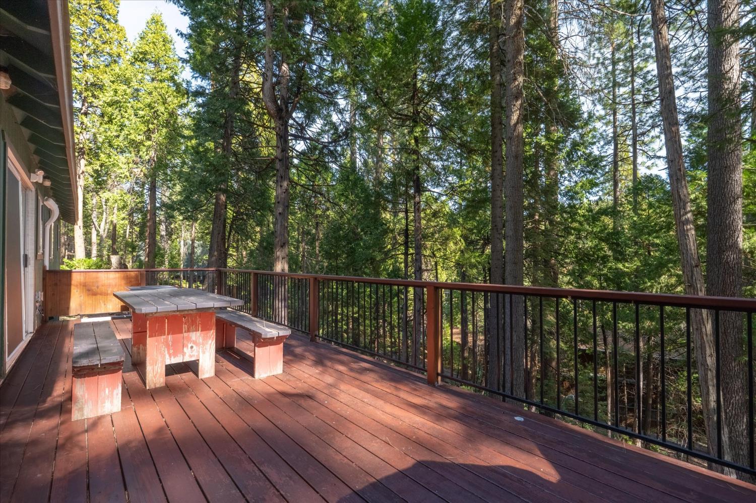 485 Moran Road Arnold, CA 95223 - Photo 33 of 49 a balcony with wooden floor and outdoor seating