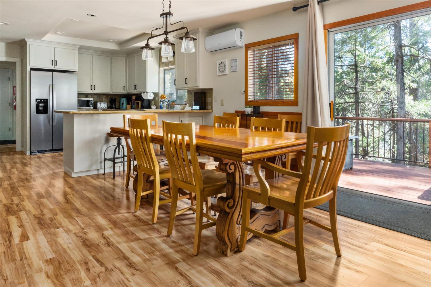 485 Moran Road Arnold, CA 95223 - Photo 9 of 49 a dining area with stainless steel appliances granite countertop furniture wooden floor and a kitchen view
