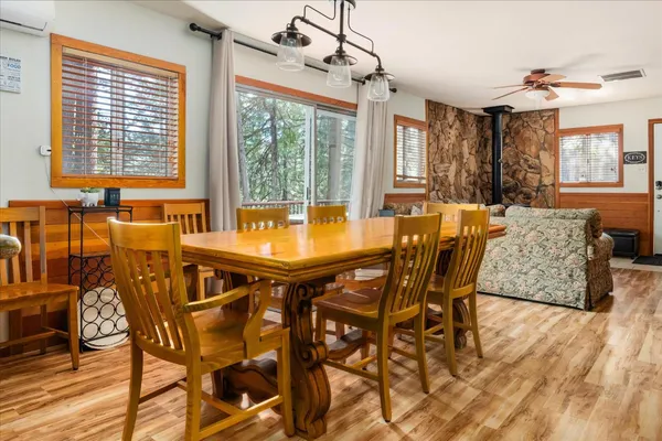 a dining room with furniture and window