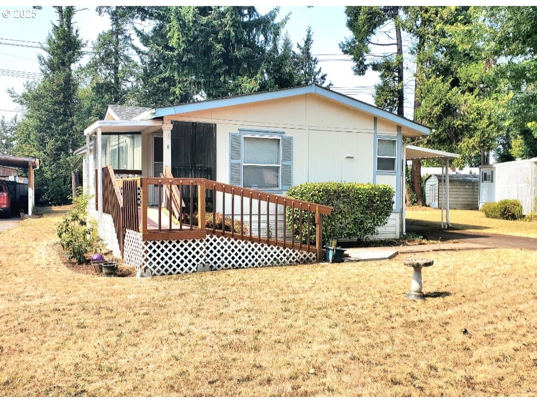 1125 58th Street, Unit 6 Springfield, OR 97478 - Photo 1 of 27 a view of a house with a yard