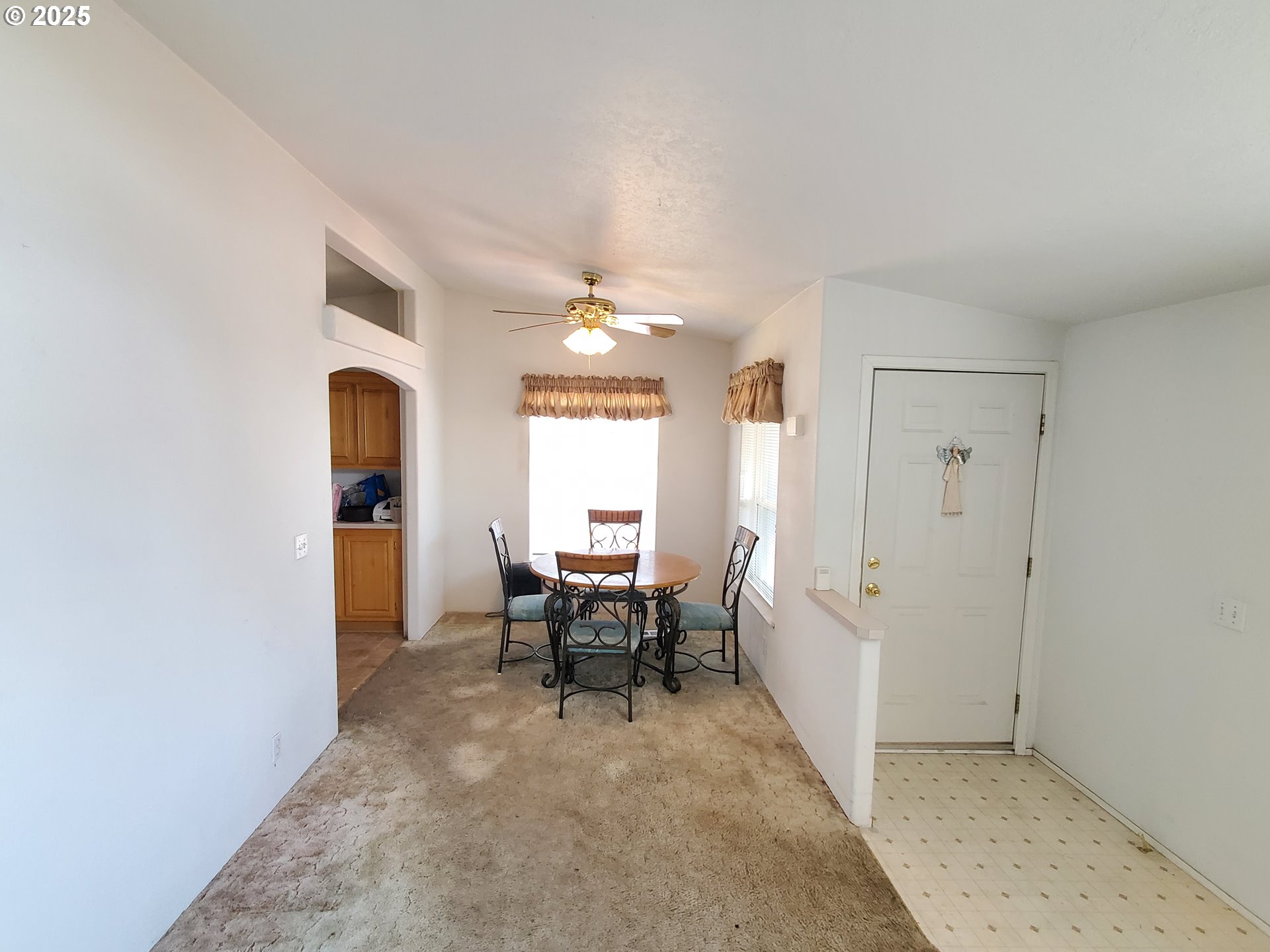 1125 58th Street, Unit 6 Springfield, OR 97478 - Photo 11 of 27 a view of a livingroom with furniture and window