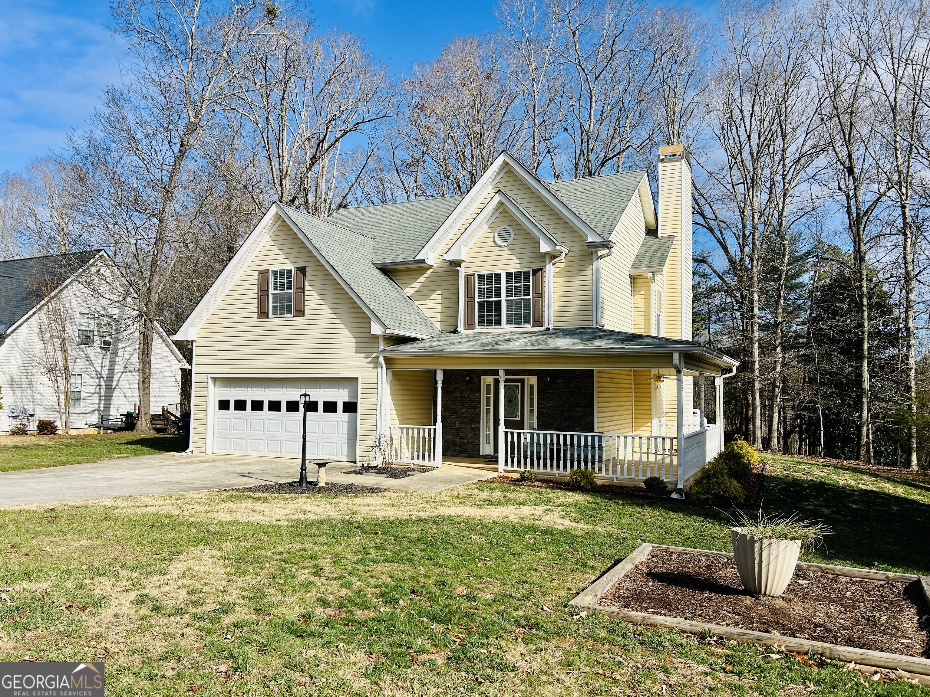 129 Rockwind Way Demorest, GA 30535 - Photo 1 of 45 a front view of a house with garden