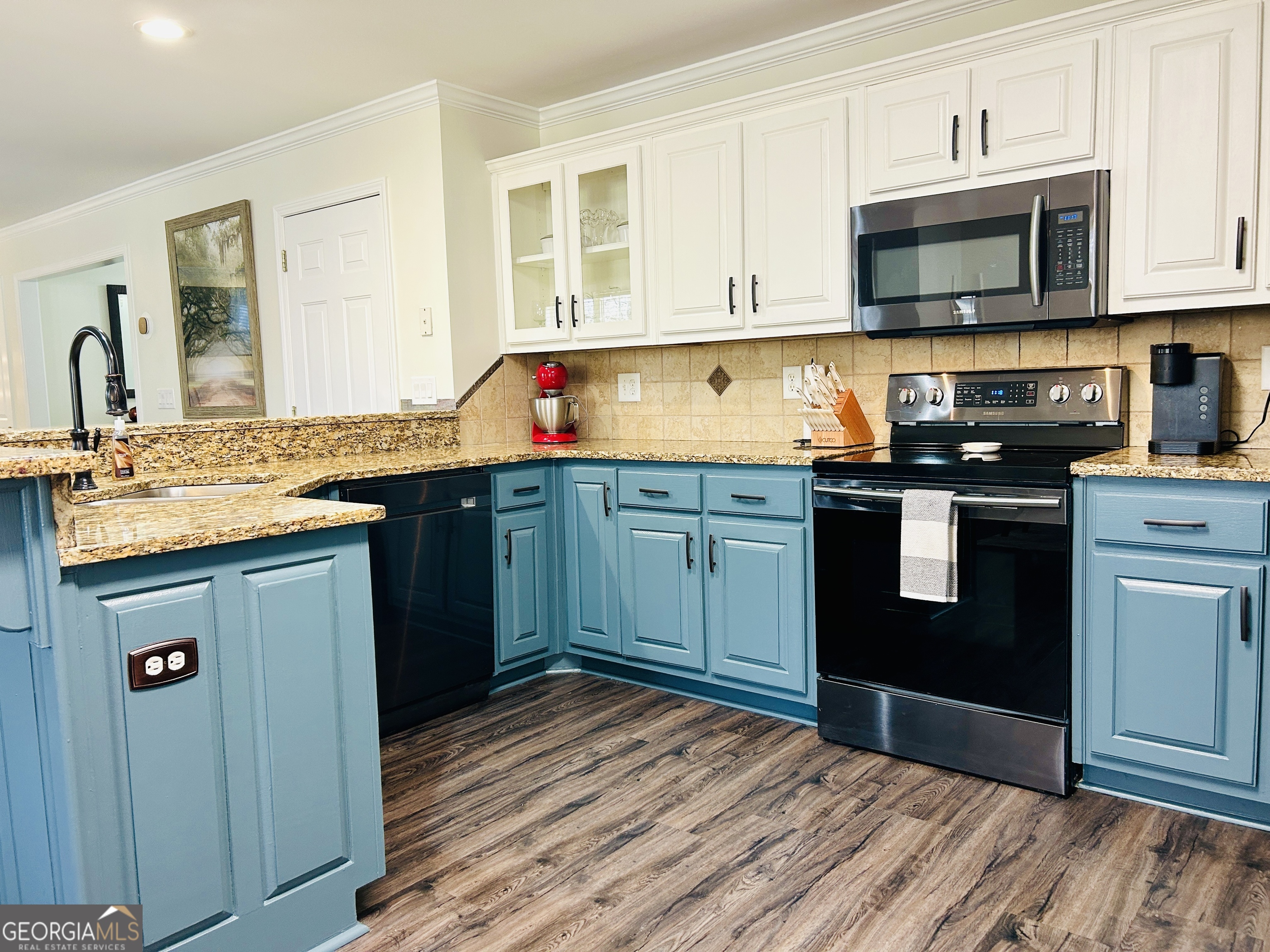129 Rockwind Way Demorest, GA 30535 - Photo 12 of 45 a kitchen with stainless steel appliances granite countertop a sink stove and microwave