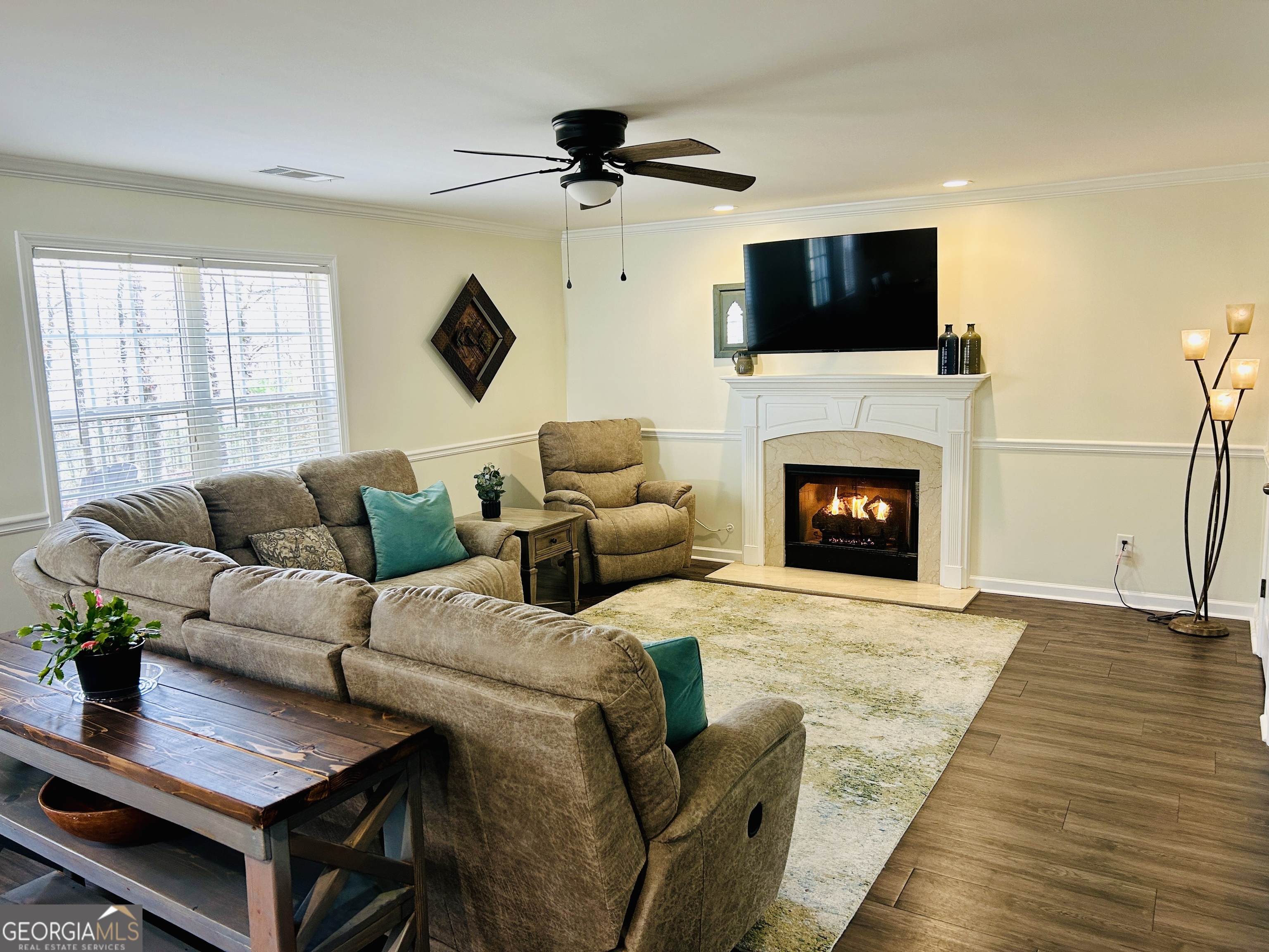 129 Rockwind Way Demorest, GA 30535 - Photo 16 of 45 a living room with furniture a fireplace and a flat screen tv