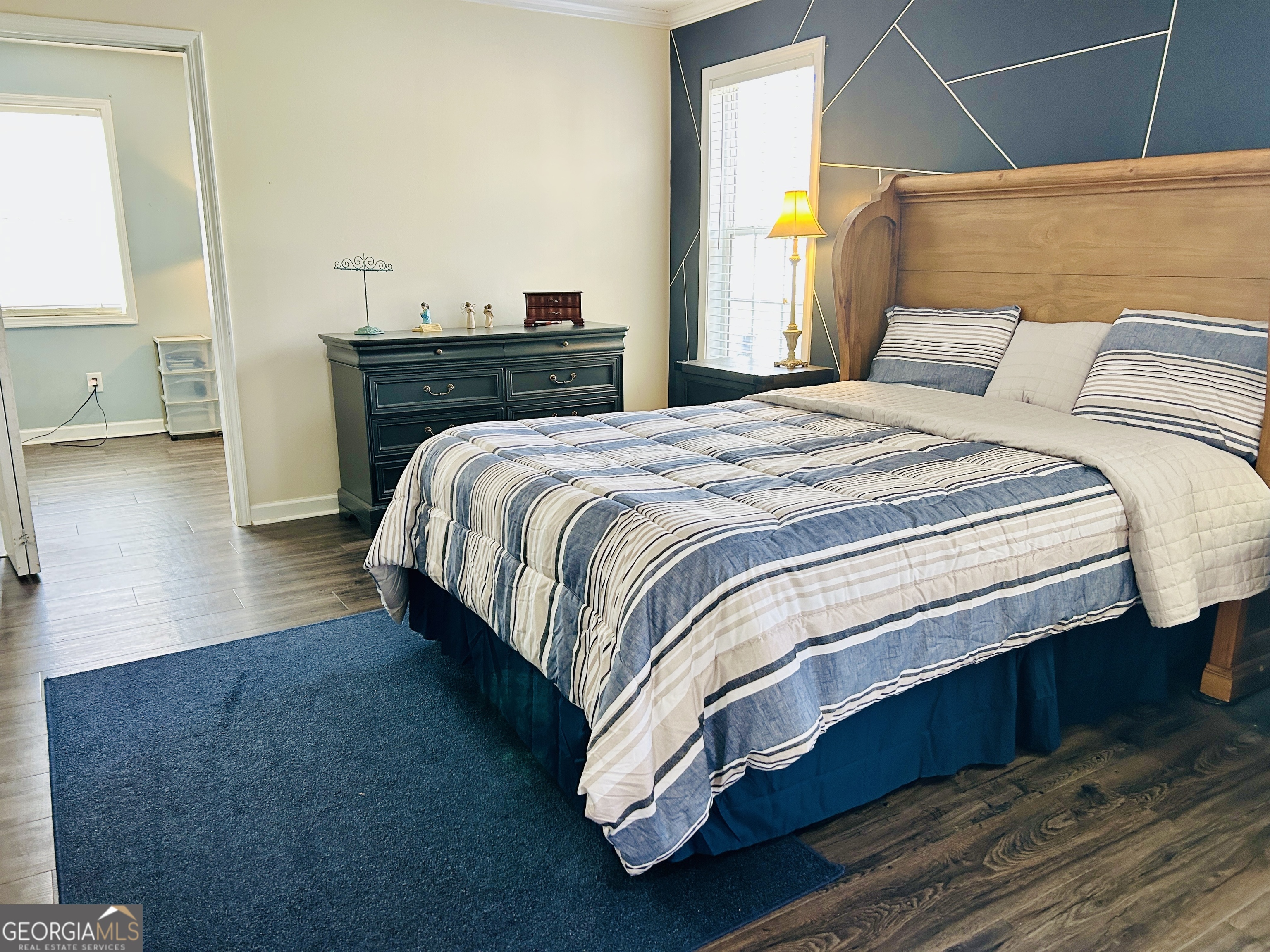 129 Rockwind Way Demorest, GA 30535 - Photo 21 of 45 a bedroom with a bed and wooden floor