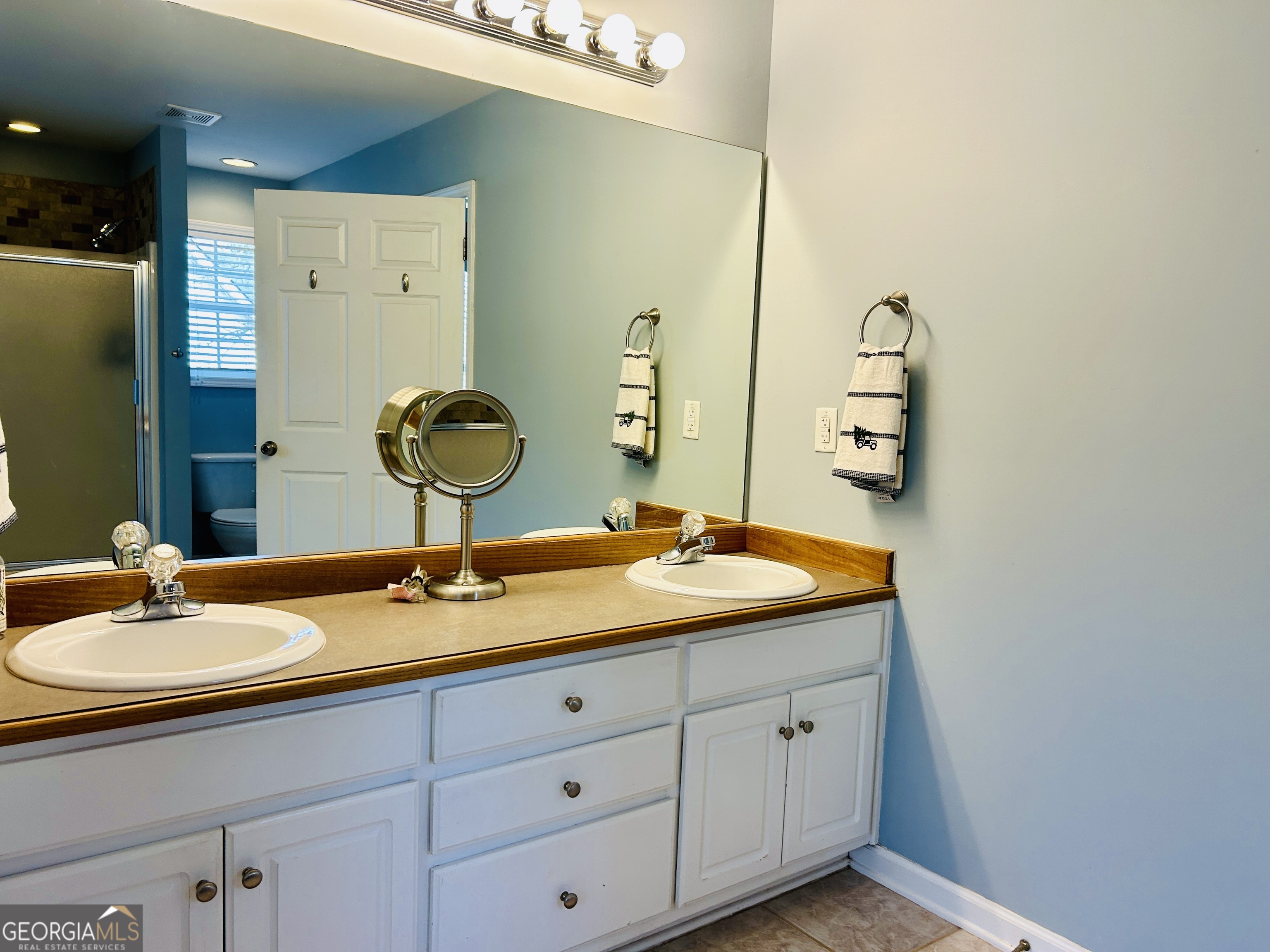 129 Rockwind Way Demorest, GA 30535 - Photo 25 of 45 a bathroom with a granite countertop sink and a mirror